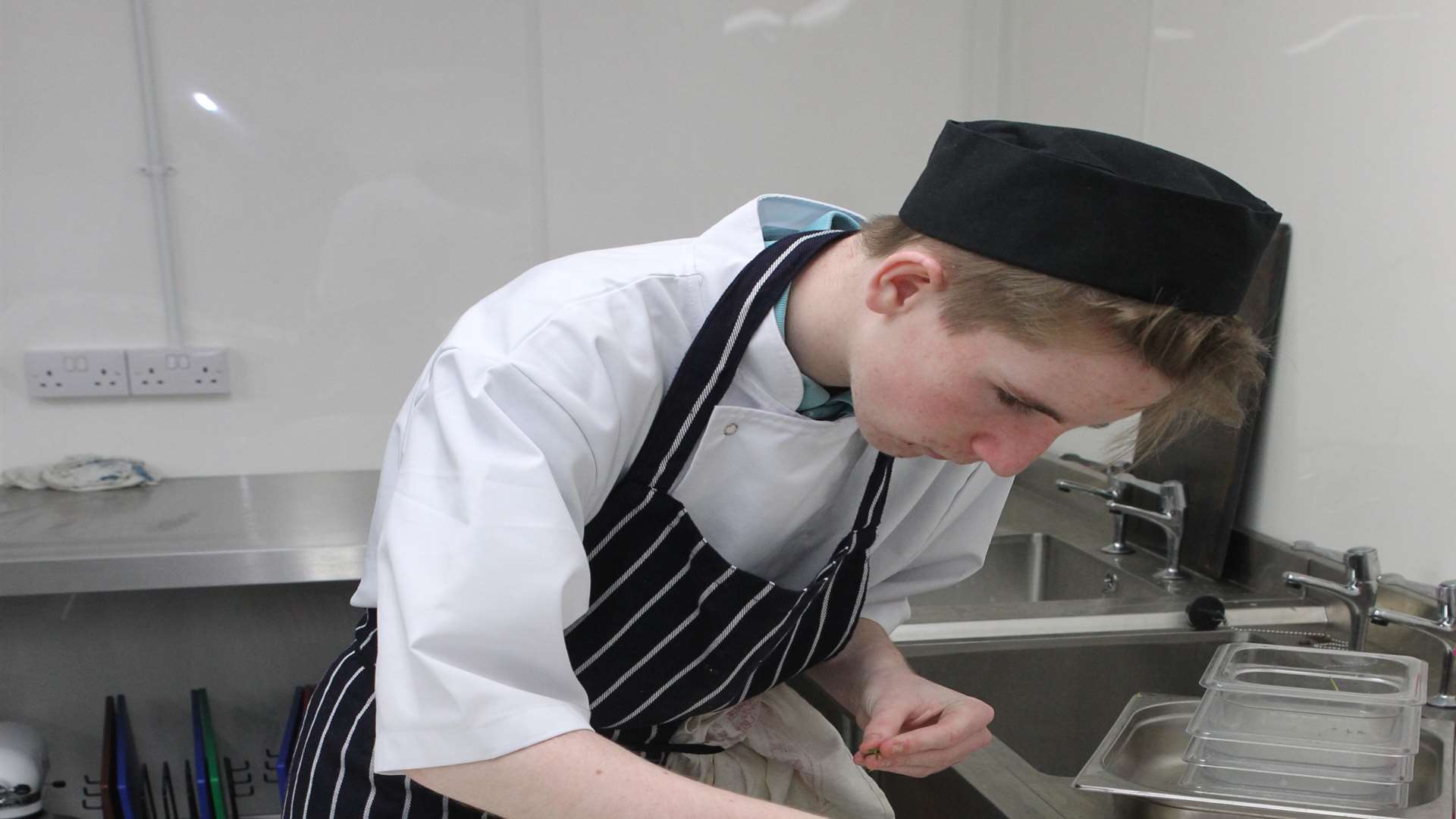 Callum Balfe, 16, helps prepare a starter of prawns with homemade tagliatelle.