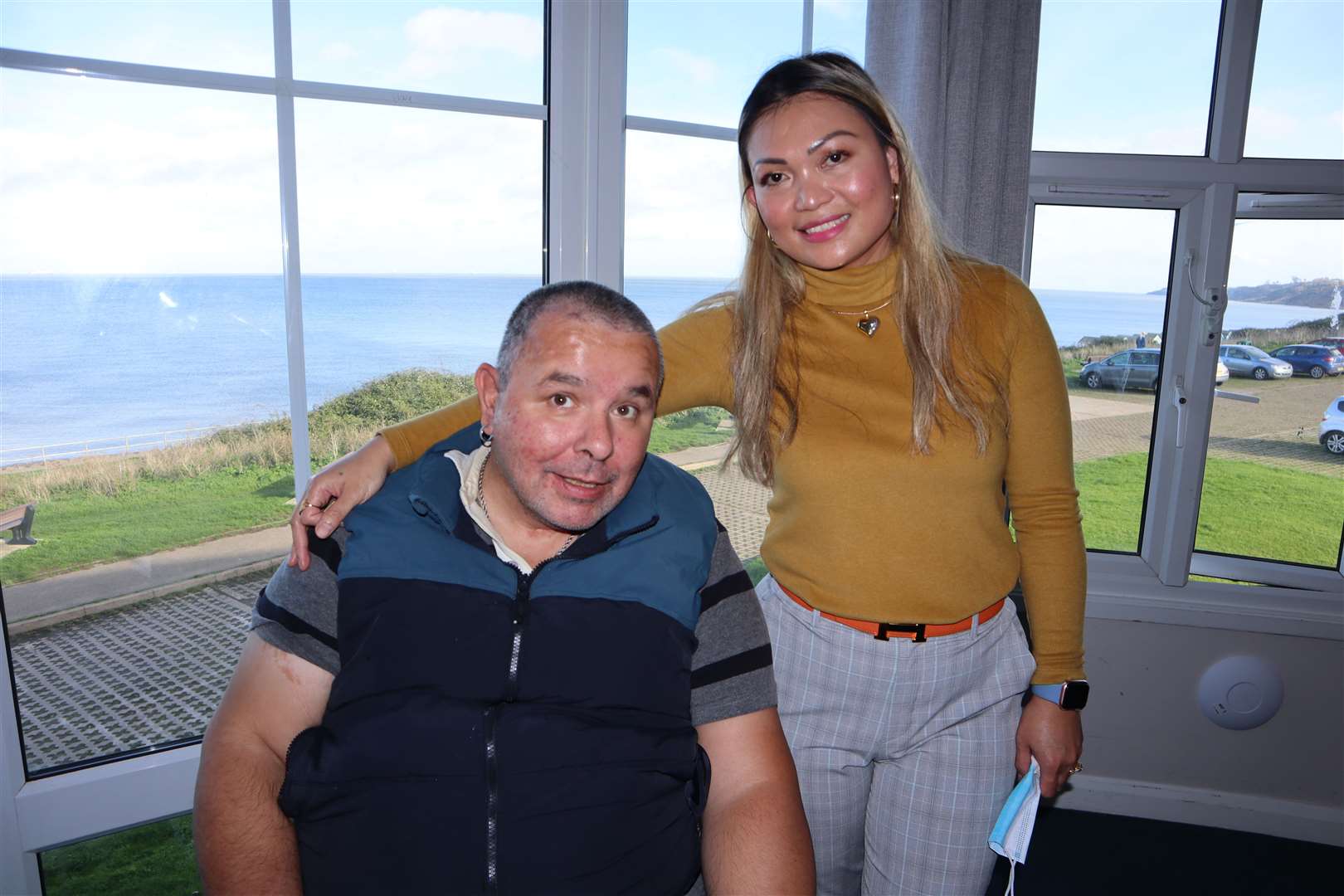 Former lorry driver Robin Searle, 51, from Sittingbourne, pictured with staff member Leah Fisher, is a resident at the Little Oyster residential home on The Leas at Minster, Sheppey, since suffering a stroke