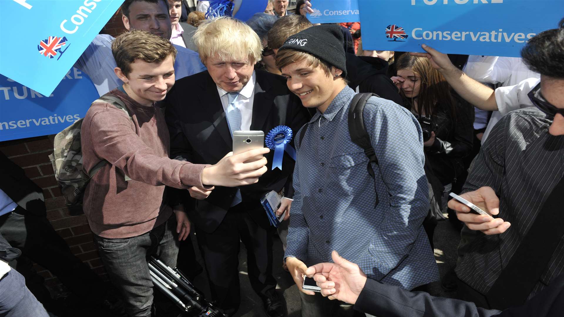 Boris takes a selfie with members of the public