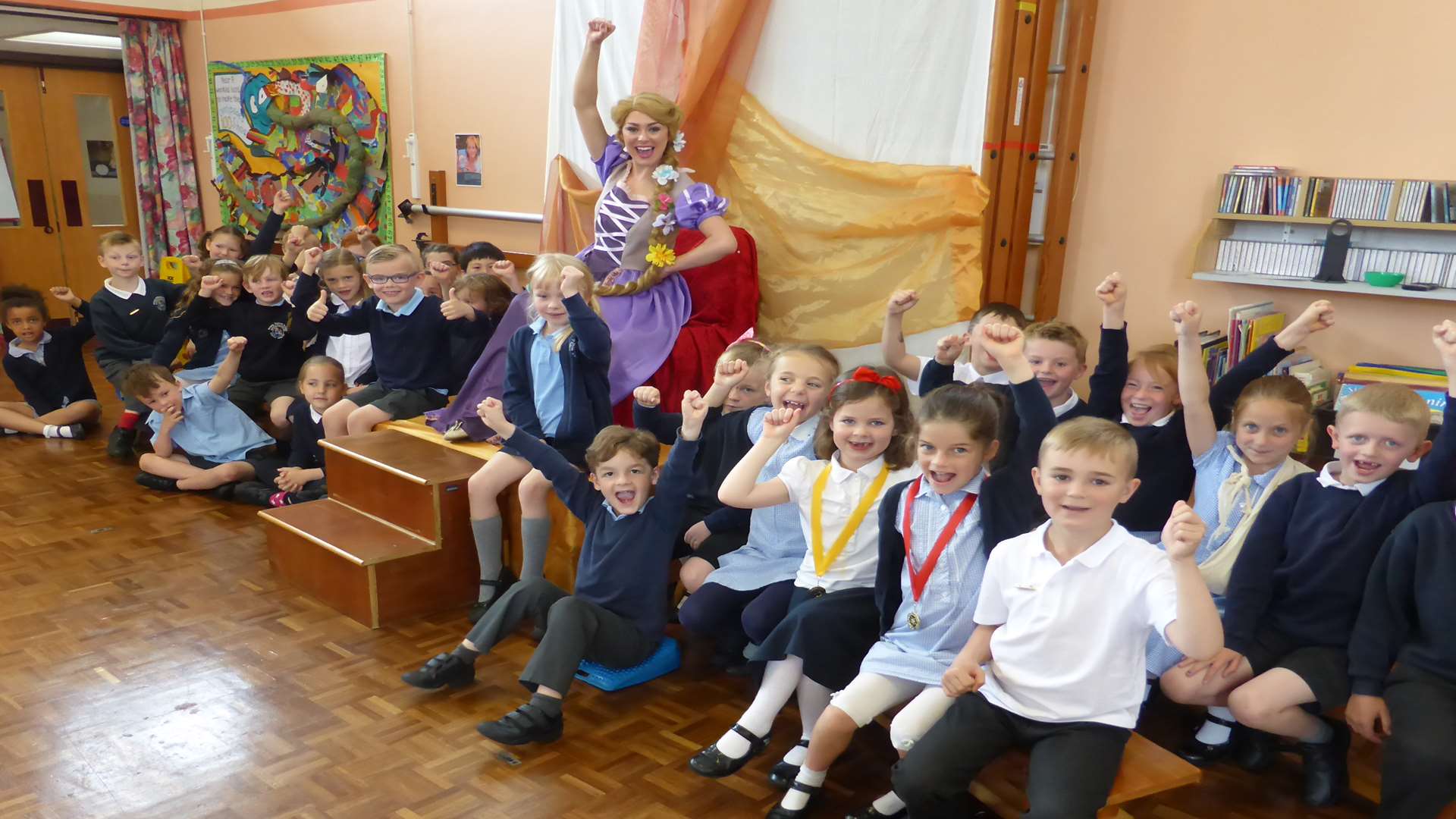 Rapunzel visits Priory Infants School, Thanet to deliver a story time session to reward the school for its walk to school campaign.