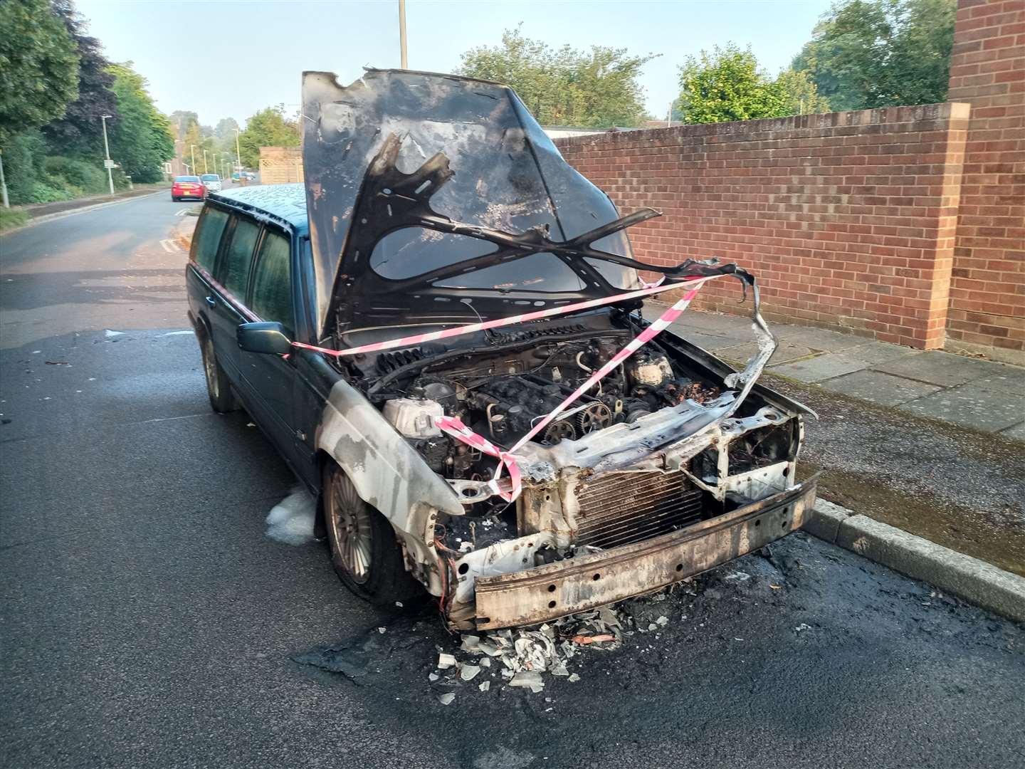 A car destroyed by flames in Bishops Way, Canterbury