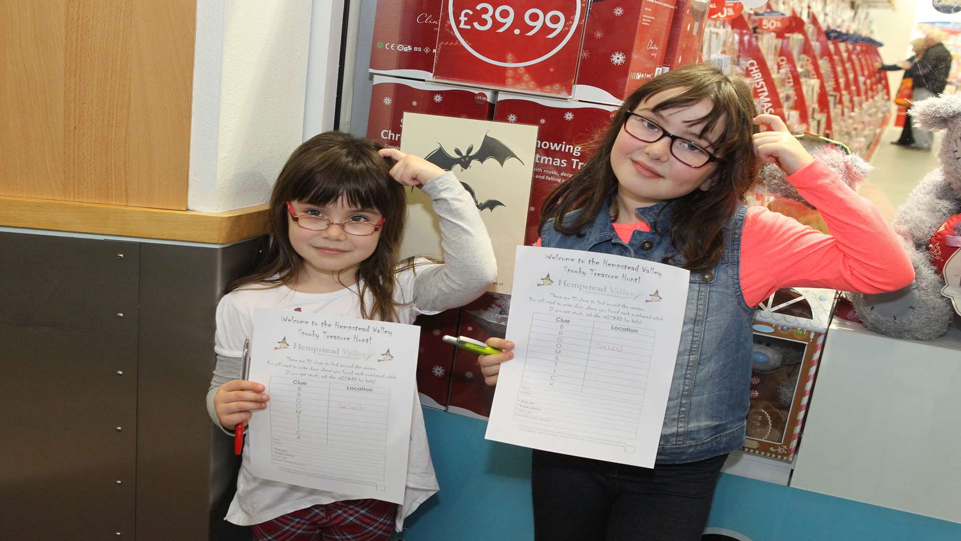 Kayleigh Sanders, six with her sister, Nikita, 10, look for Treasure Hunt clues at Hempstead Valley Shopping Centre