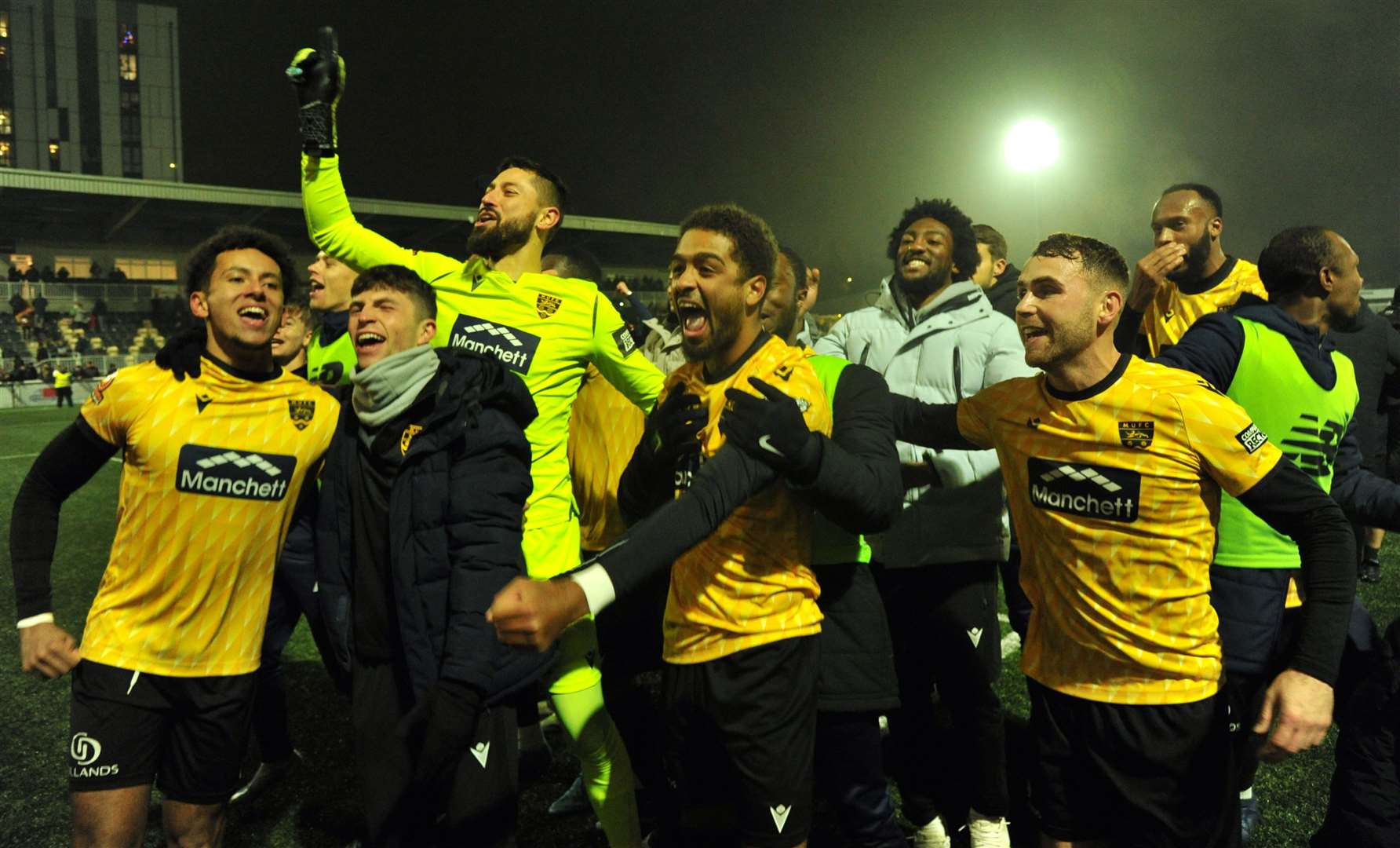 Party time for Maidstone in front of the Genco Stand after beating Barrow 2-1 in the FA Cup second round. Picture: Steve Terrell
