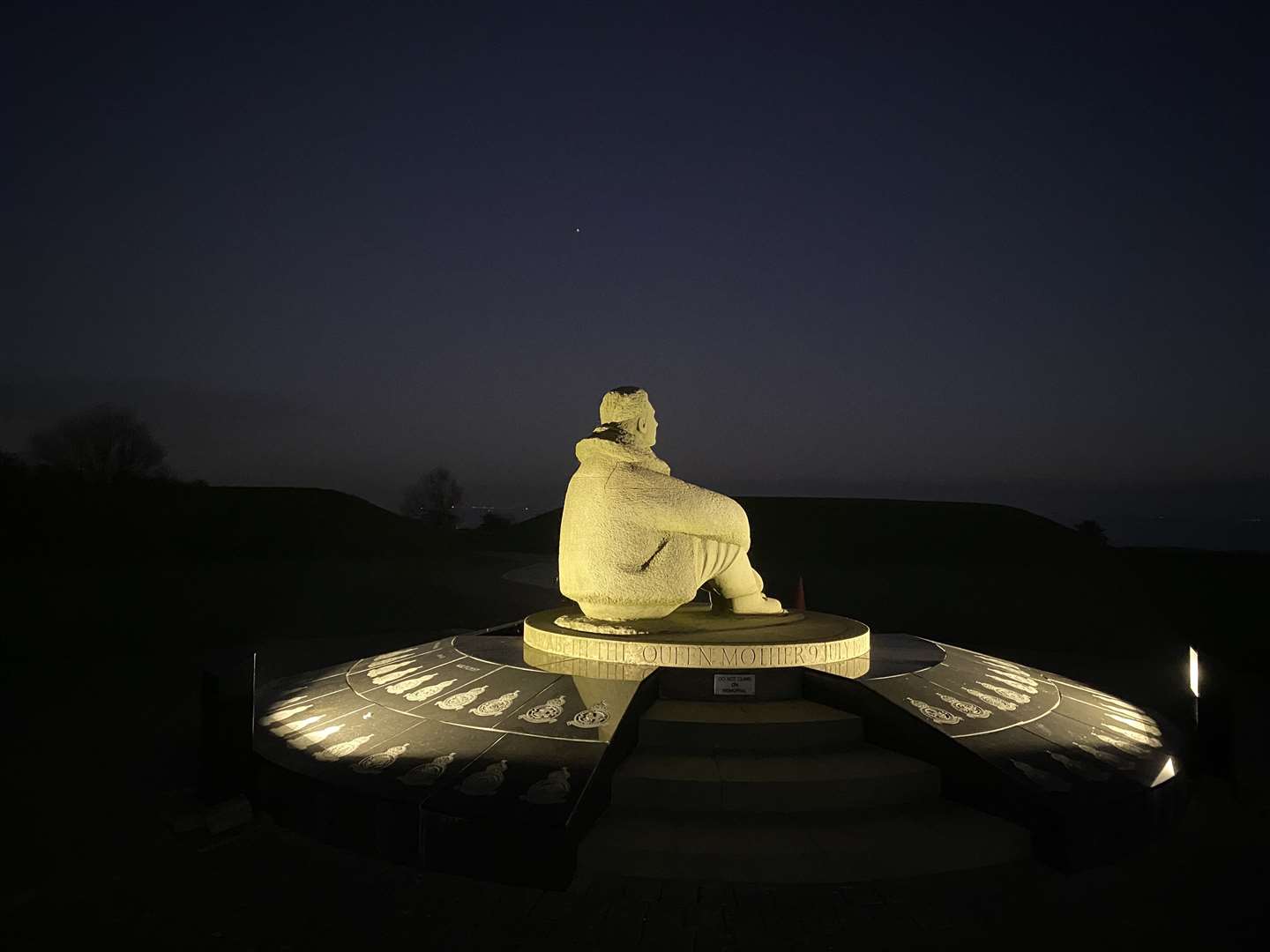 The National Memorial to the Few is now lit by floodlights at dusk