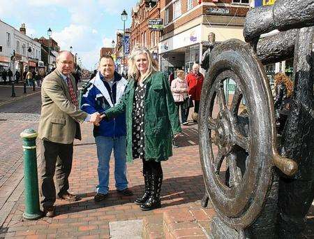 Regeneration cabinet member Cllr John Wright, chairman of Sittingbourne Retail Association, Nick Smith, and chief executive of Litter Angels, Sioux Peto, celebrating the news Sittingbourne High Street is to receive a £35,000 cash boost.