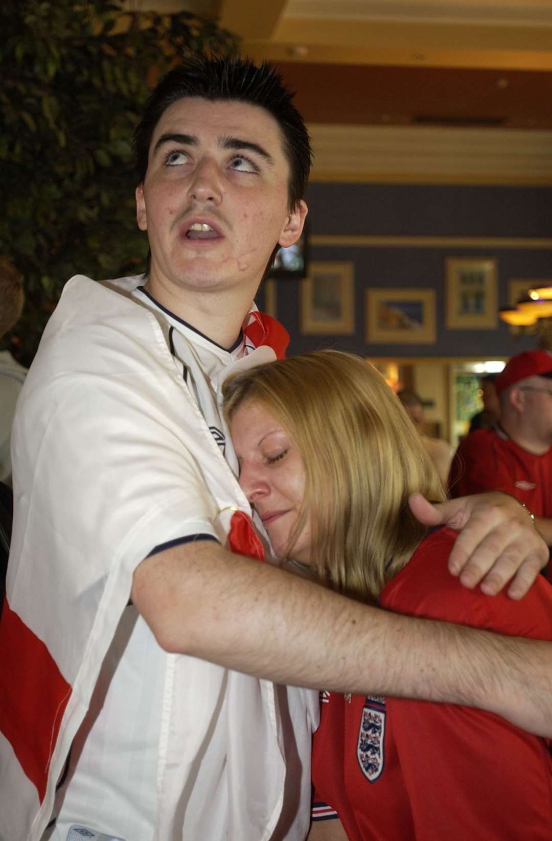Fans at The Litten Tree console each other after the final whistle