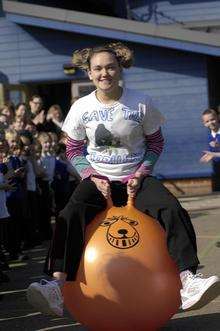 Emily Hodgson,18 sets off from Aldington primary school on a sponsored space hop to raise funs to save the gorillas