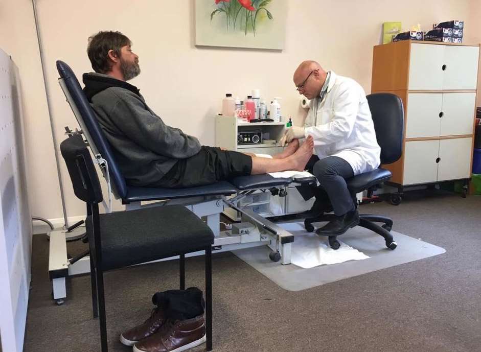 Paul Miller treating a homeless man at Strood Chiropody and Podiatry, at St Mary's Medical Centre in Strood. Pic: Medway Street Angels