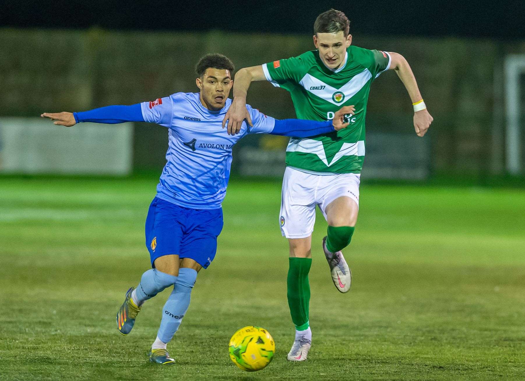 Ashford United defender Dan Hull holds off his man against Lancing Picture: Ian Scammell