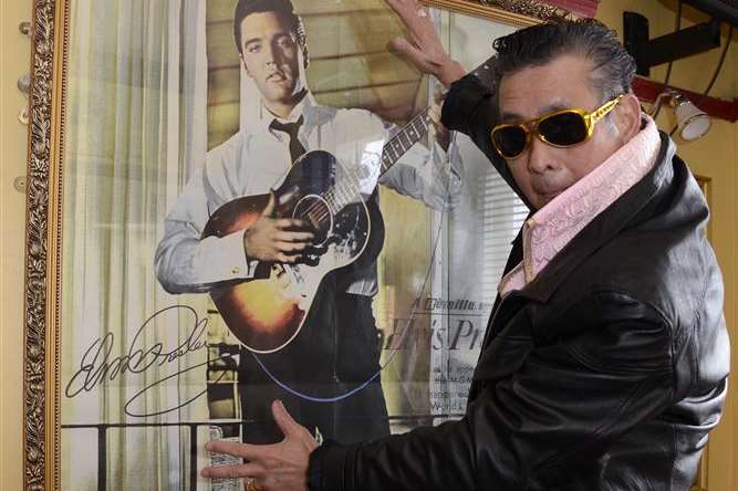 The walls of Tang Ma's restaurant are adorned with Elvis memorabilia