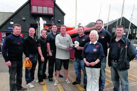 Seasalter Sailing Club Committee presents money to Whitstable RNLI