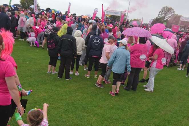 The runners have even donned pink umbrellas. Pic: CRUK
