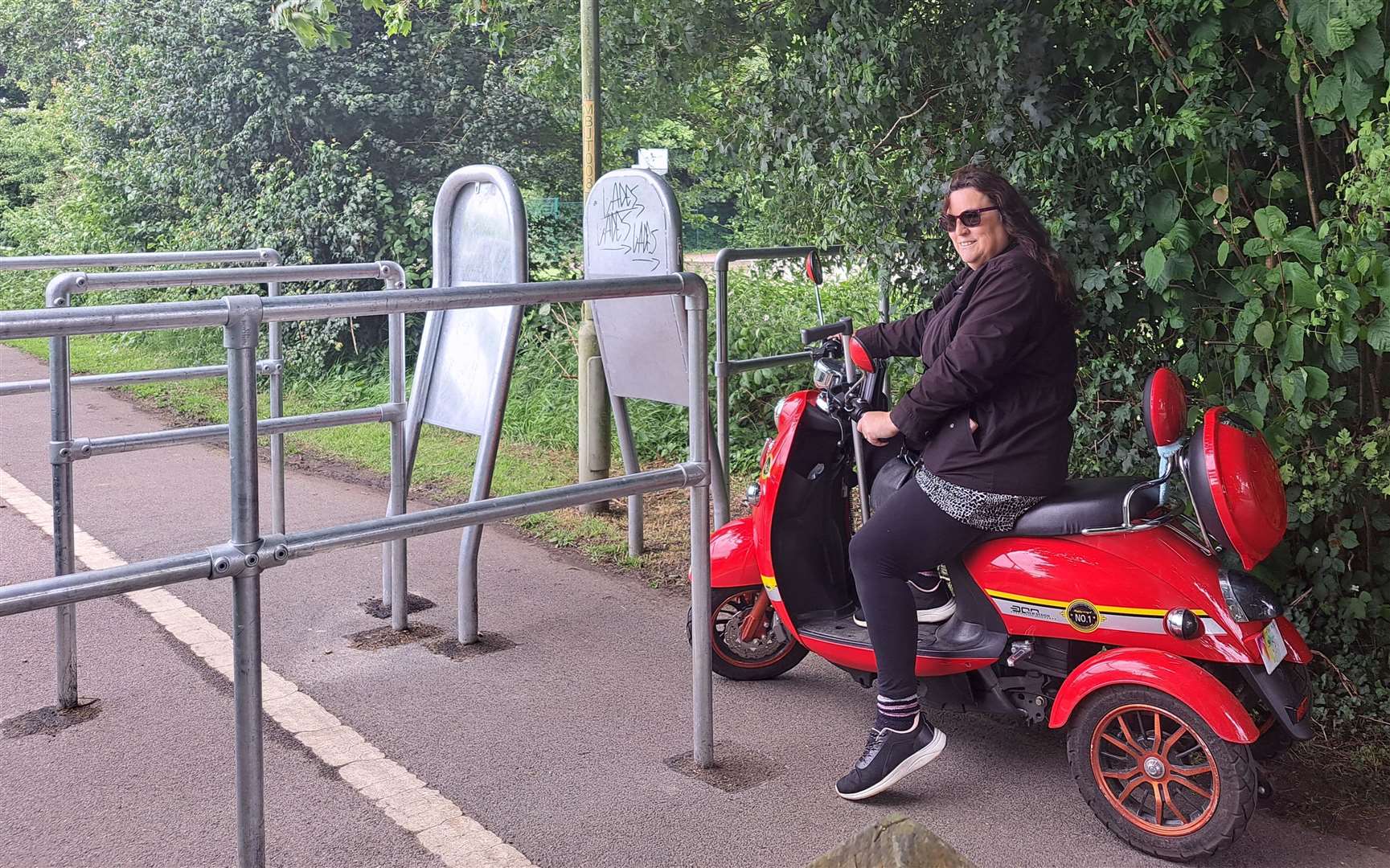 Ms Kellam's scooter is too wide to get through the barriers
