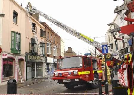 Firefighters work at the scene of the blaze on Saturday. Picture: Chris Davey