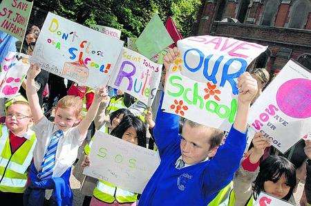 Children protest outside Tuesday's cabinet meeting