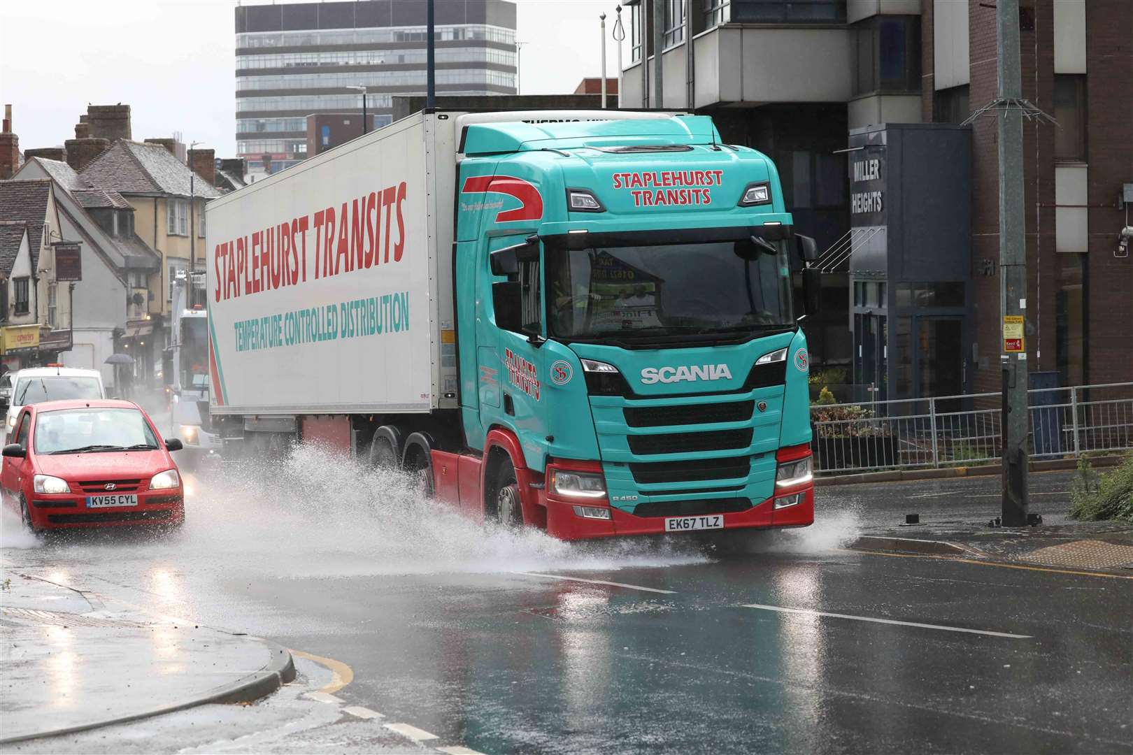 A lorry drives through larges pools of water in Lower Stone Street, Maidstone. Picture: UKNiP (41371904)