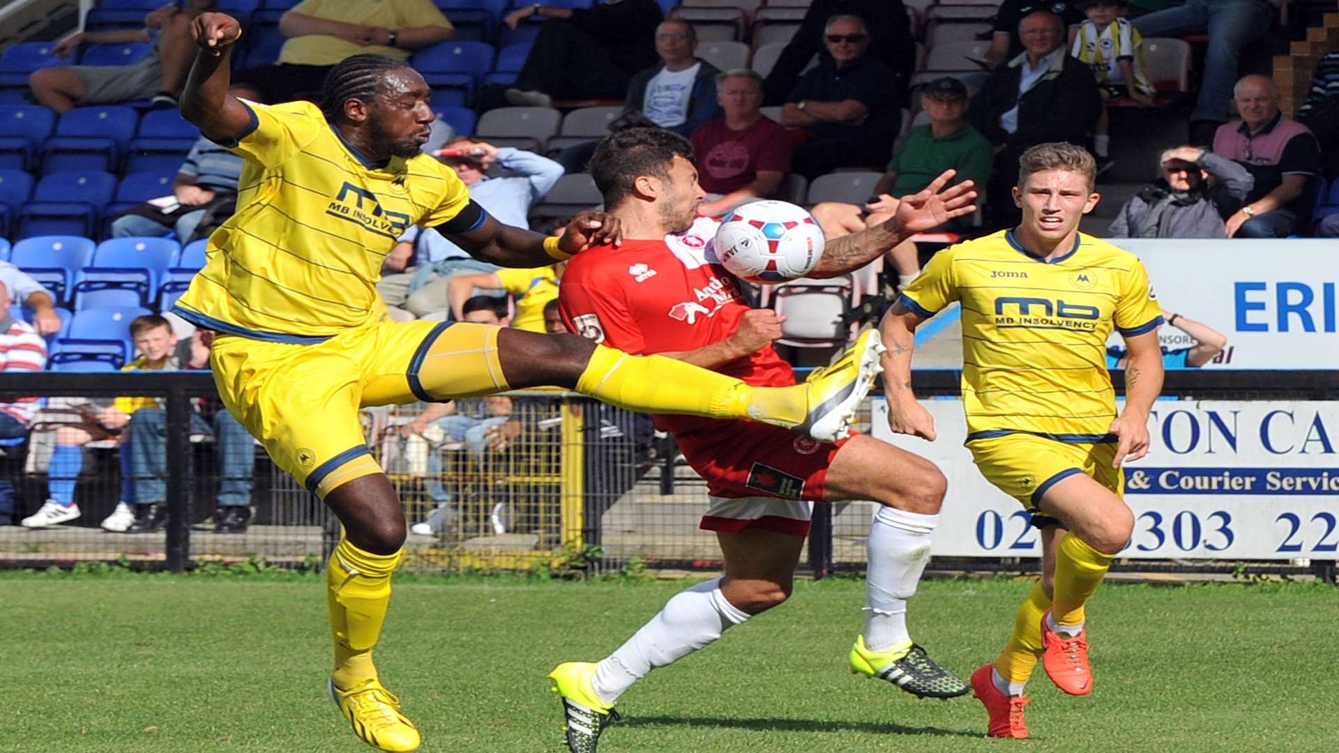 Welling forward George Porter in the thick of the action against Torquay. Picture: David Brown