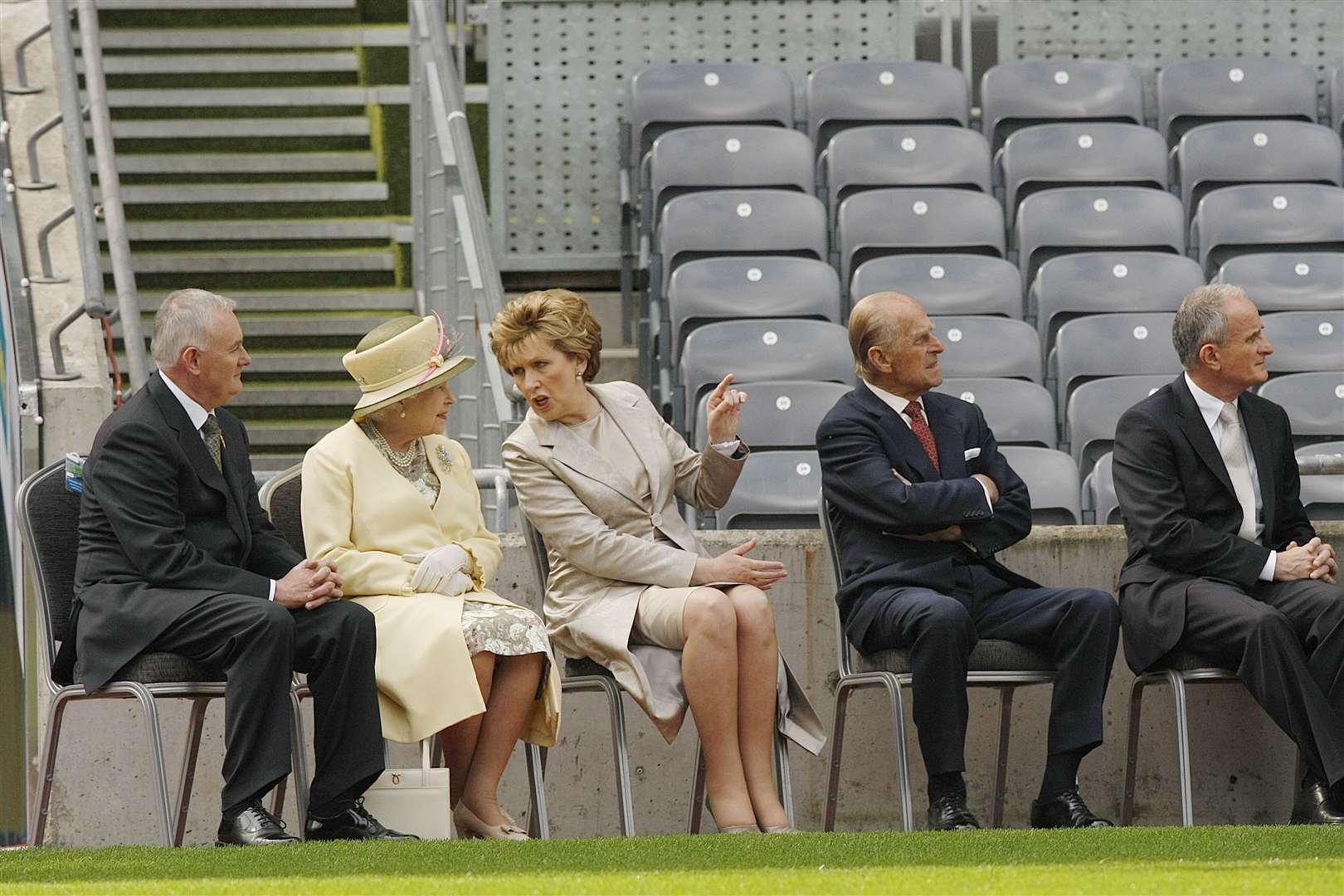 Former GAA President Christy Cooney, then President of the Irish Republic Mary McAleese, Queen Elizabeth II, the Duke of Edinburgh and Dr Martin McAleese watch a video about Gaelic football at Croke Park (Julien Behal/PA Wire)