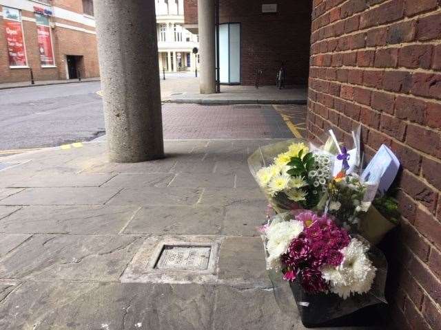 Flowers left by the scene of the incident in Rose Lane