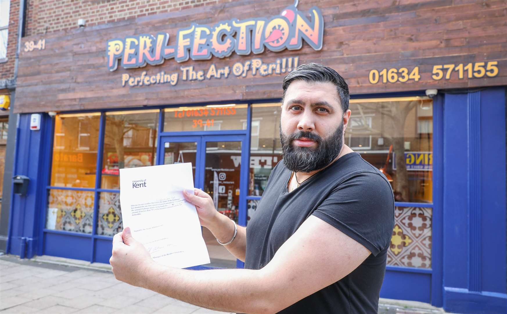 Pardeep Singh with the fake receipt for his charity donation. Picture: Matthew Walker