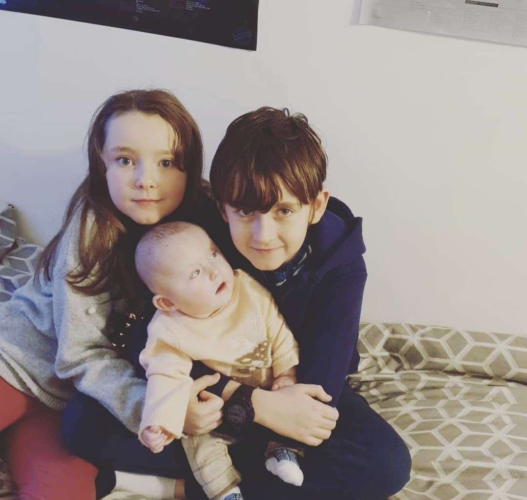 Sophia, eight, and Dylan, 11, with baby sister Willow