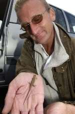 RETURN: Nick Moulton with one of the young sand lizards