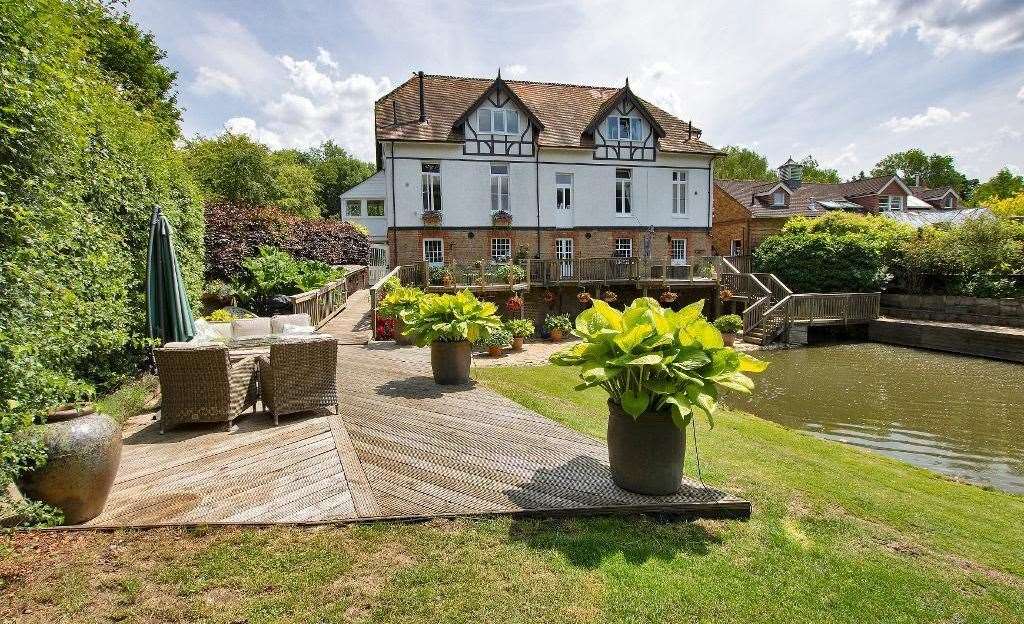 Take a seat on the terrace and enjoy views of the pond. Picture: Harpers and Hurlingham