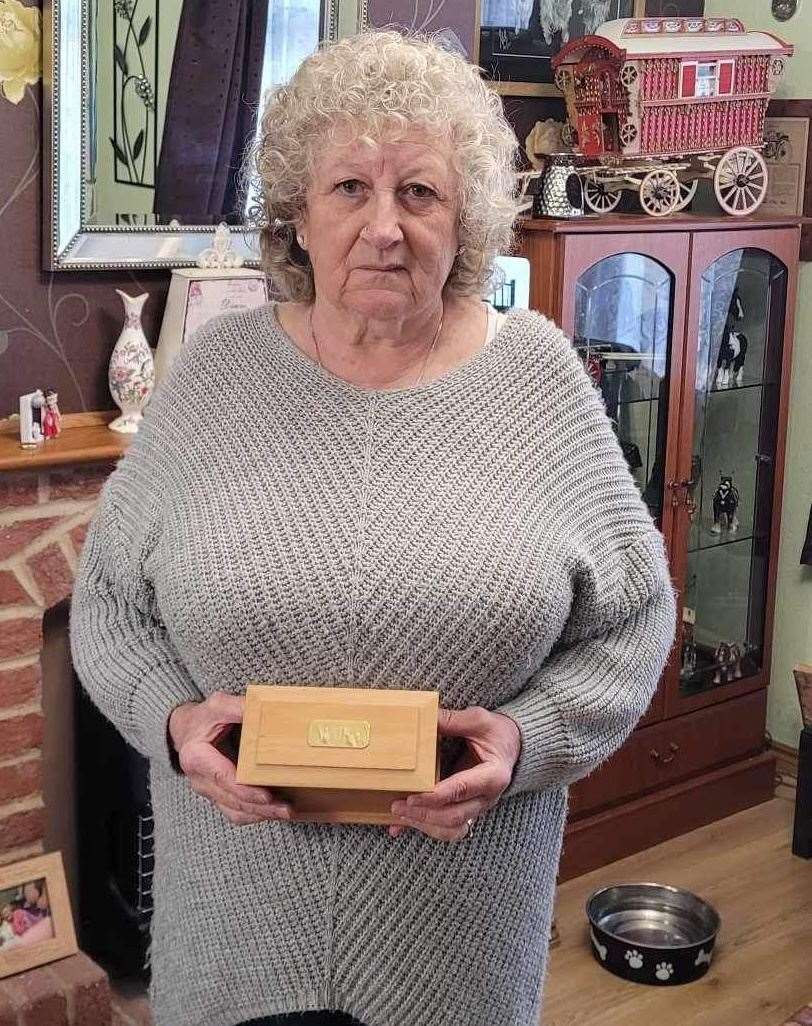 Dianne holding a box filled with Wilfie’s ashes. Picture: Jam Press