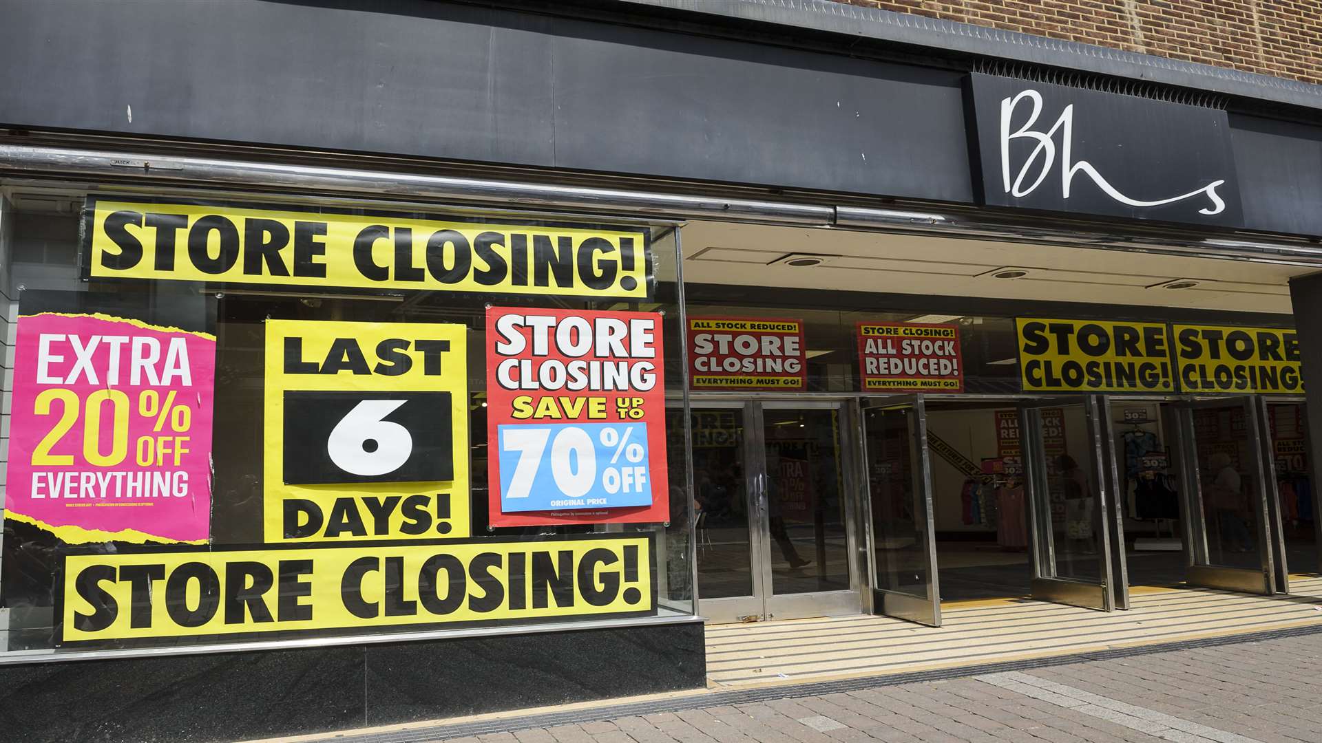 Store closing notices in the window of BHS.