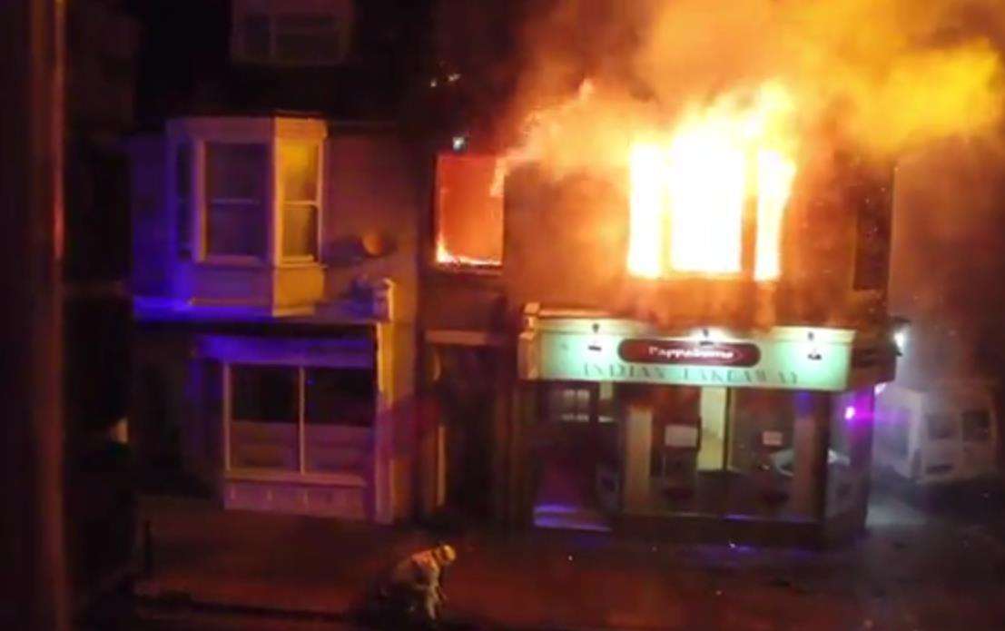 Fire rips through the flat above the Pappadoms Indian in Herne Bay High Street. Picture: Phillip Royles