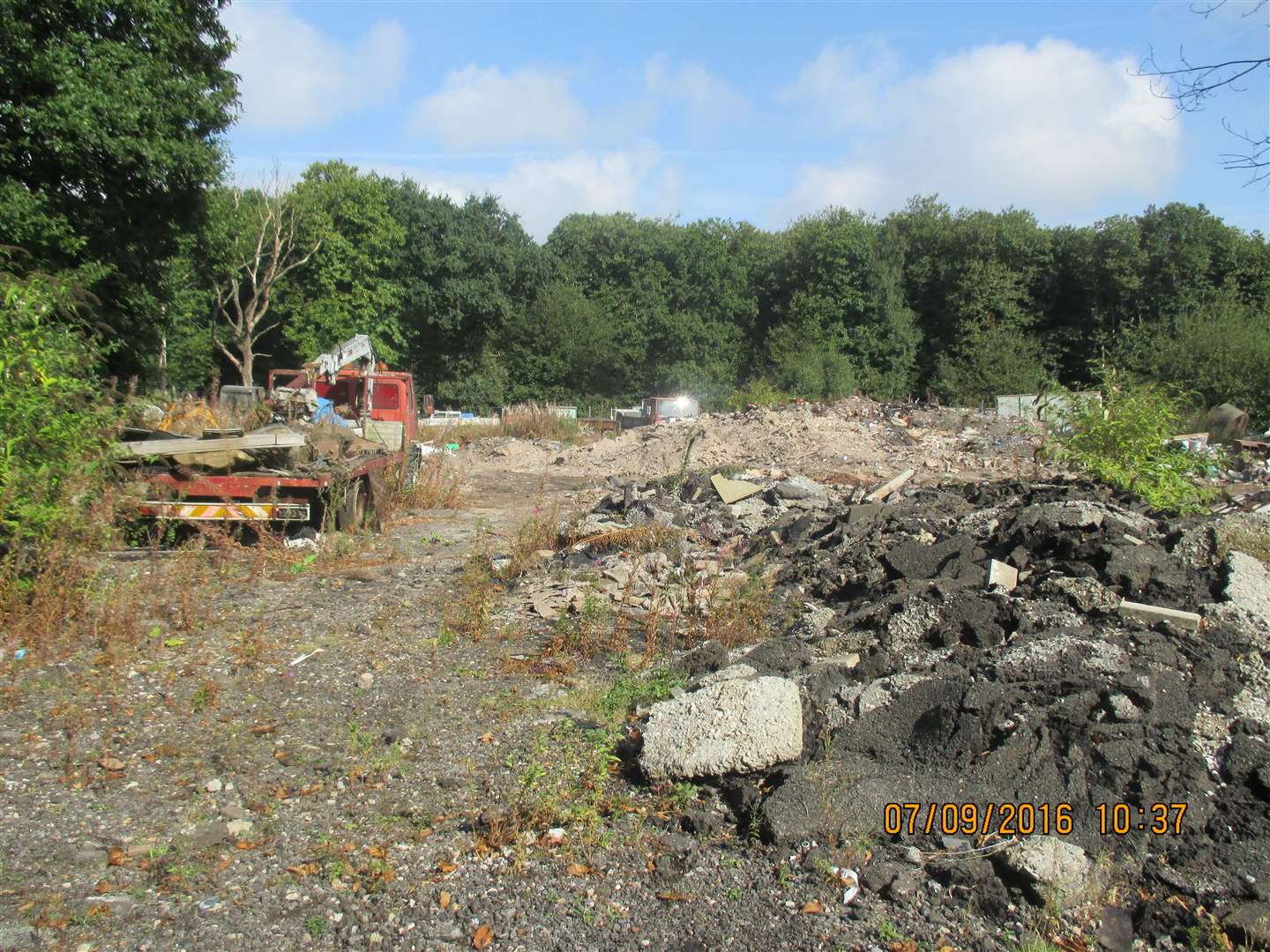 Hardcore and a flat-bed lorry in the middle of Boxley Wood on land owned by Langley Beck in 2016. Picture: Maidstone Borough Council