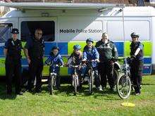Youngsters get their bikes security marked at the mobile police station in Bearsted