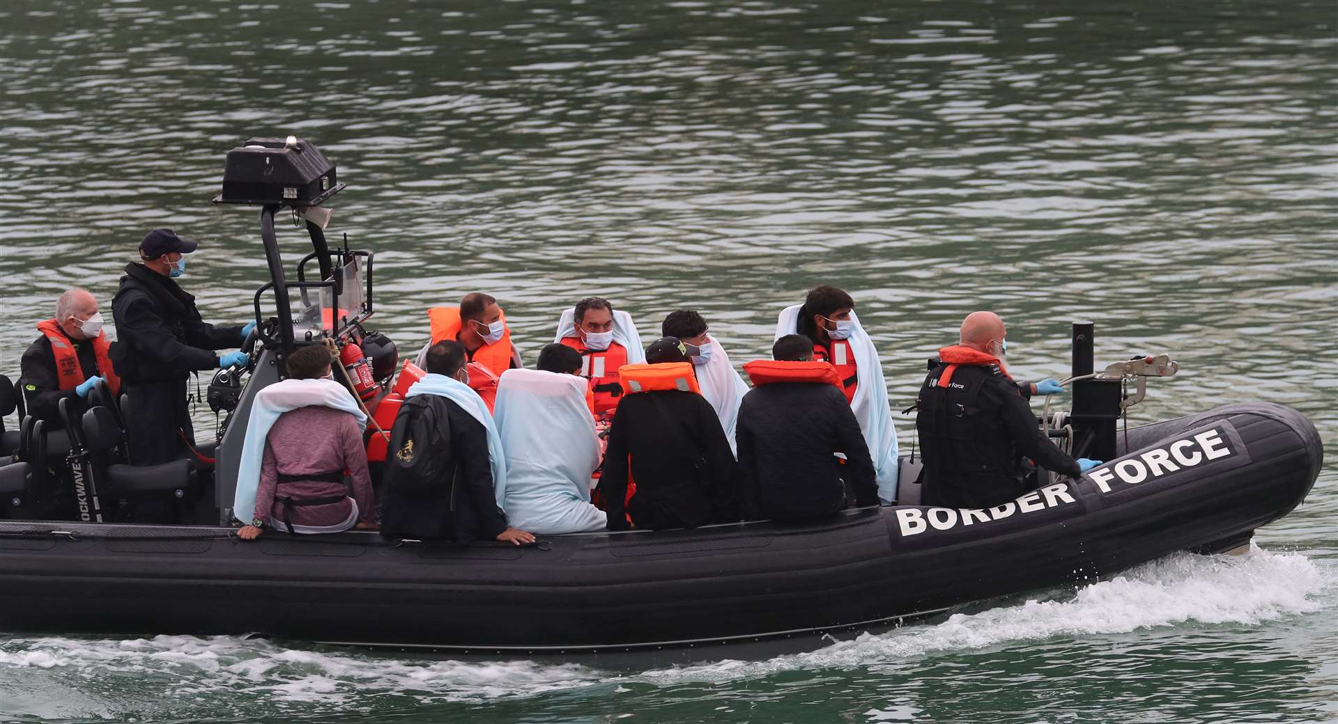 A group of people thought to be migrants are brought into Dover, Kent (Gareth Fuller/PA)