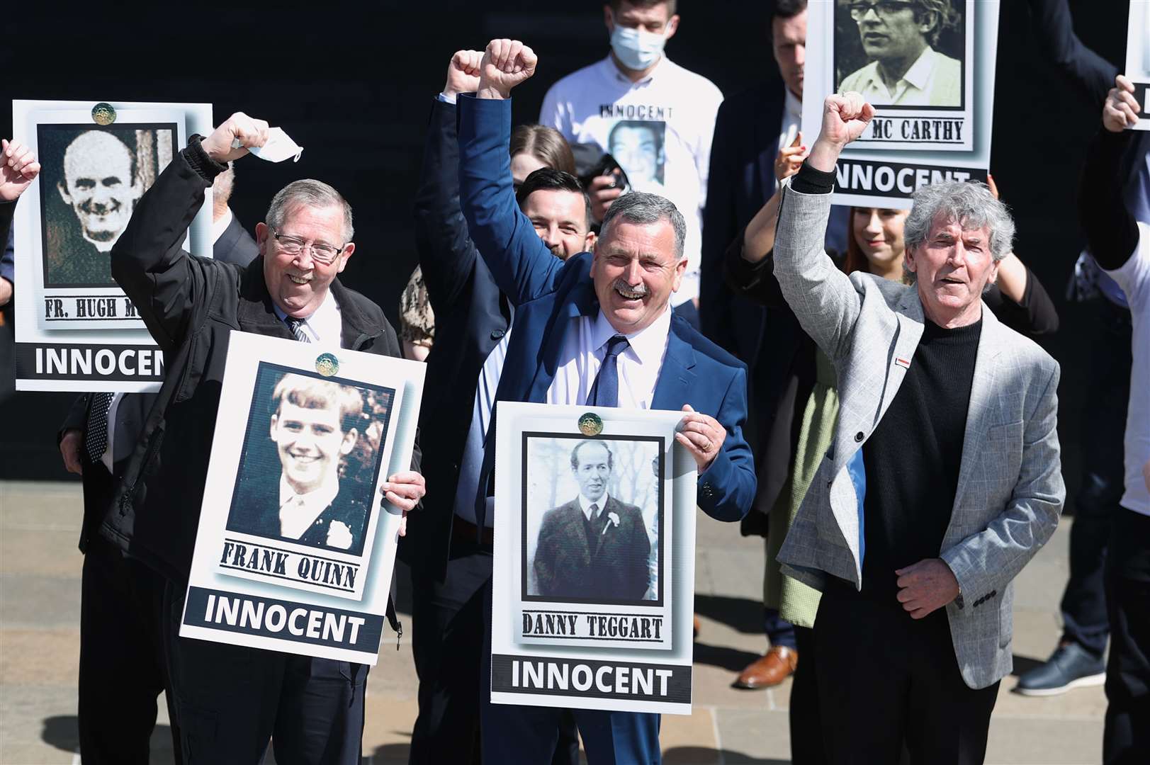 Families celebrate outside Belfast Coroner’s Court (Liam McBurney/PA)