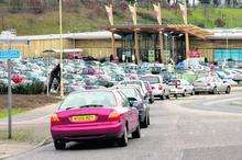 Cars queue to enter the Dobbies car park