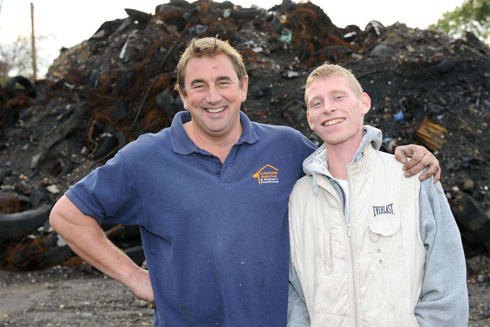 Terry Peters and Peter Doyle at the destroyed tyre yard