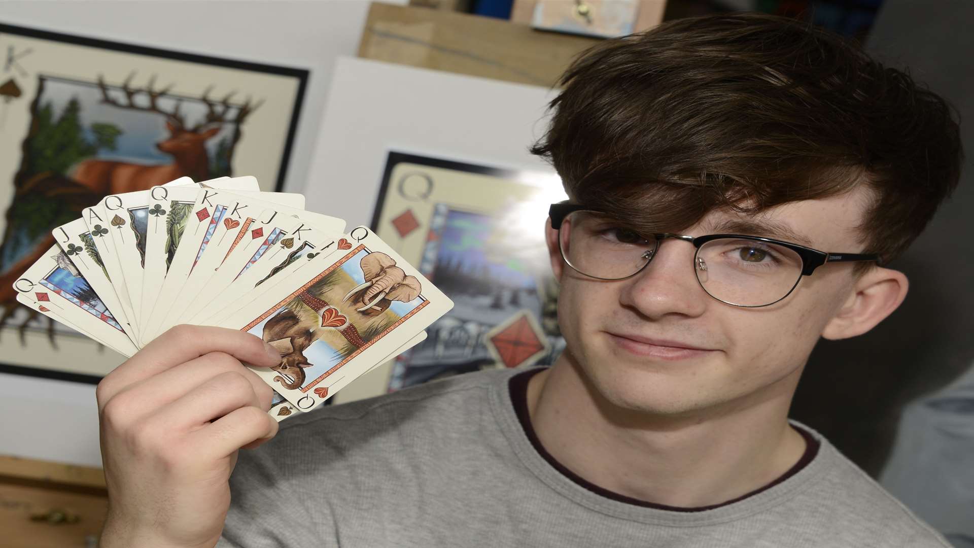 Ben Sinclair with the prototype of a pack of playing cards he has designed
