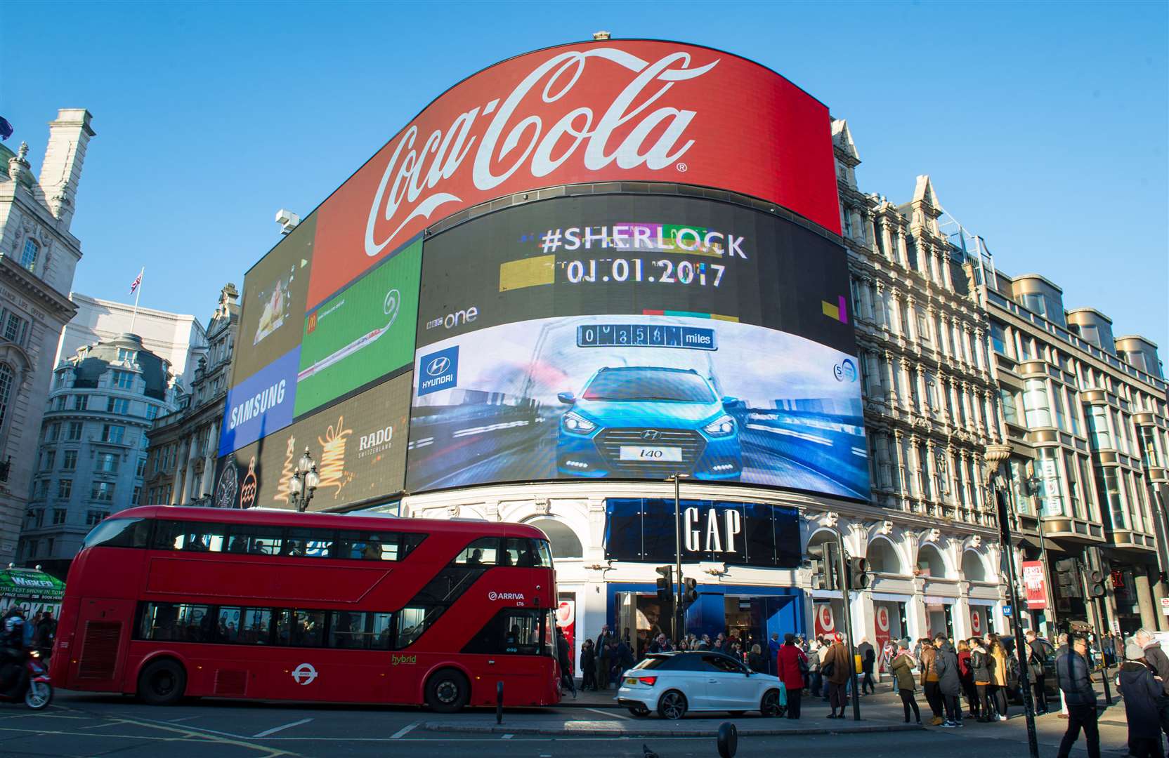 Queen's image and message of hope light up Piccadilly Circus