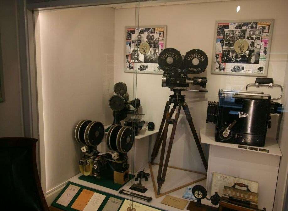 The progression of film cameras is shown in this exhibition case