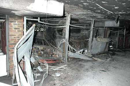 Twisted metal frames were all that remained of the garages and cars. Picture: VERNON STRATFORD