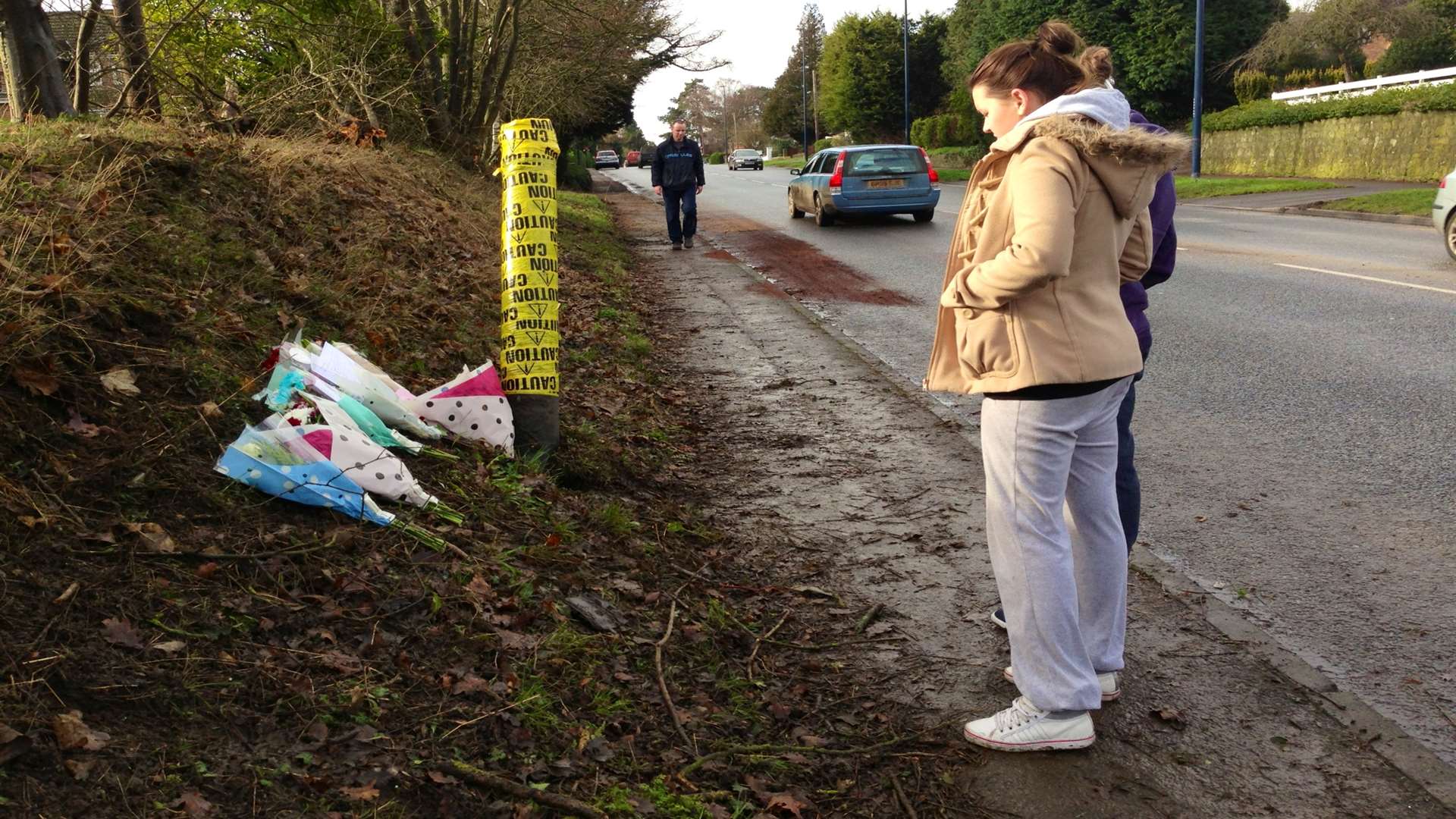 Friends pay their respects at the scene of the fatal road crash in Bearsted.