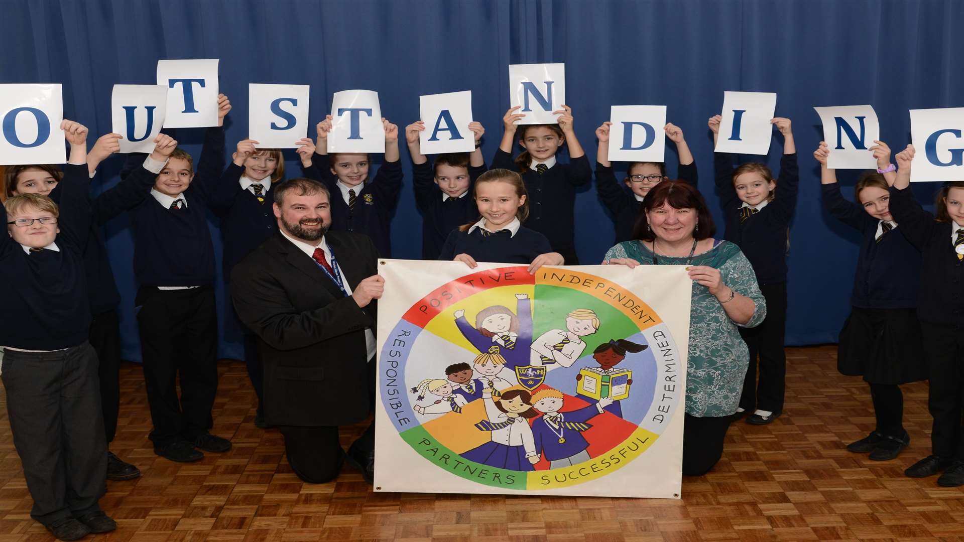 Principal, Graham Chisnell and deputy principal Anne-Marie Middleton celebrating an outstanding Ofsted with a pupils at Warden House Primary School