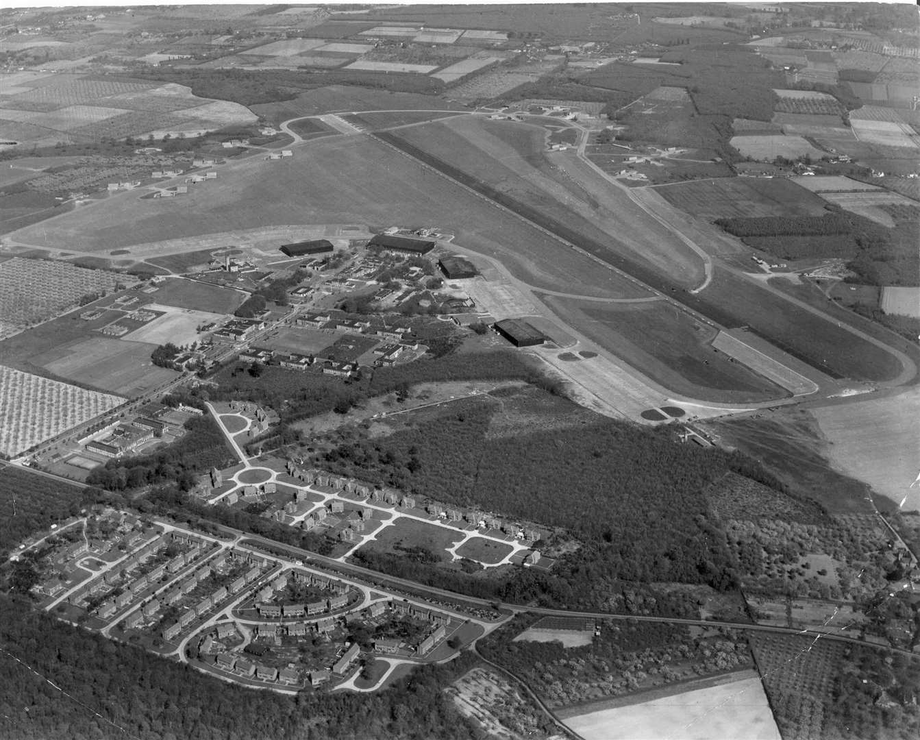 West Malling airfield in 1981. It played host to the Great Warbirds Air Displays, an annual spectacle of mammoth proportions which always drew in immense crowds. The Kings Hill development started to take shape in 1989. Picture: Skyfotos