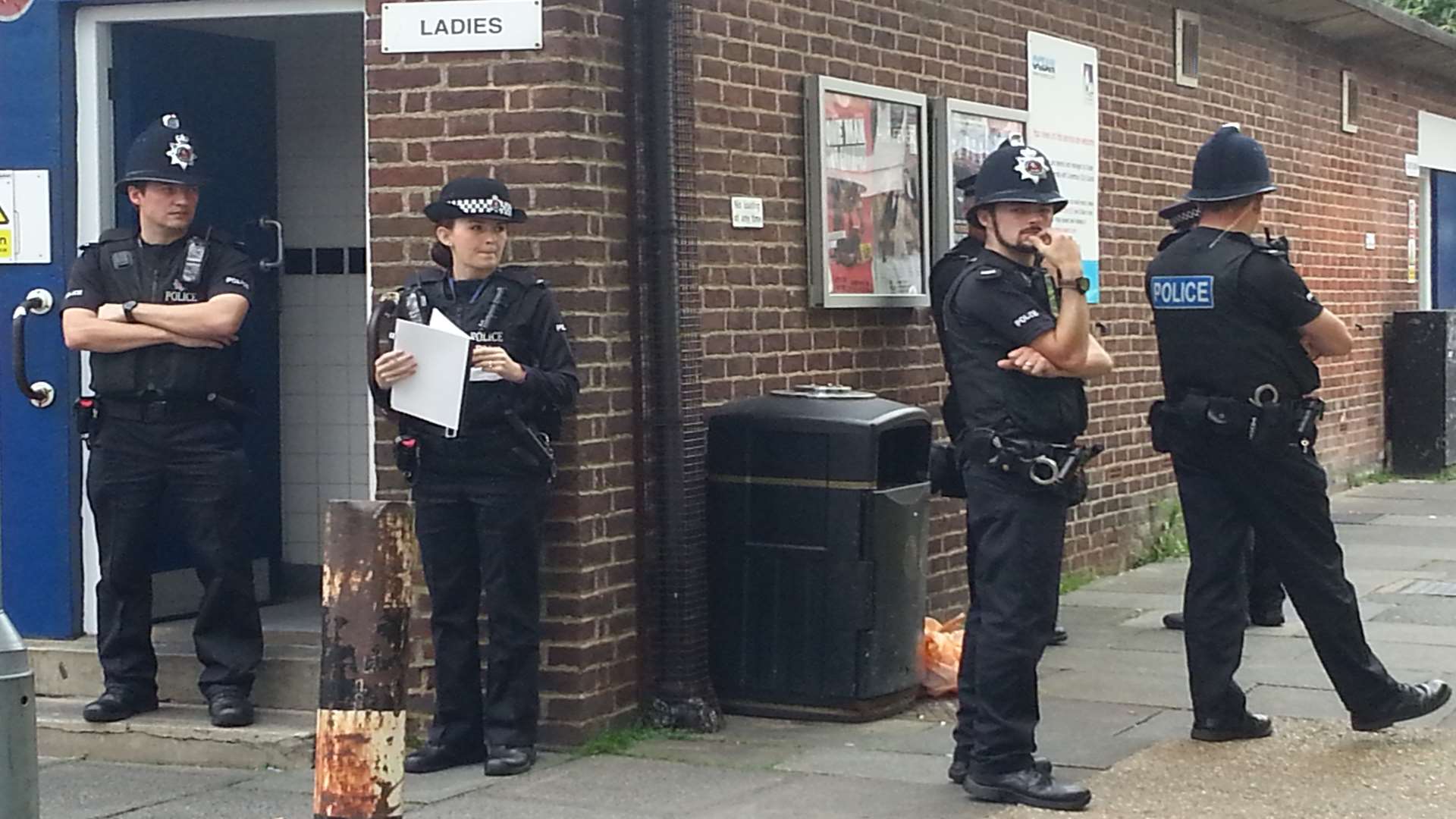Officers at the scene of the death in Canterbury Lane