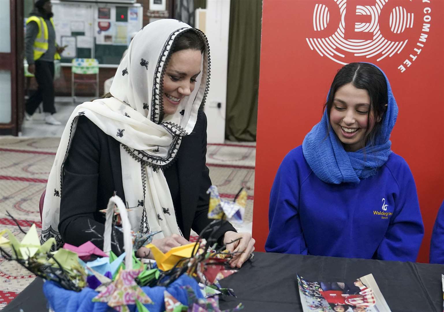 The Princess of Wales makes an origami crane with Dila Kaya at the Hayes Muslim Centre (Arthur Edwards/The Sun/PA)