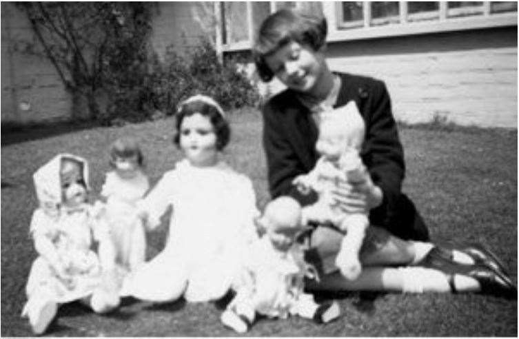 Audrey Hepburn with her dolls in the garden of Orchard Villa, Elham. Picture: Elham Historical Society/Hepburn Family Collection