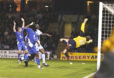 Brent Sancho beats the dive of Barry Roche to win it for Gillingham. Picture: ANDY PAYTON