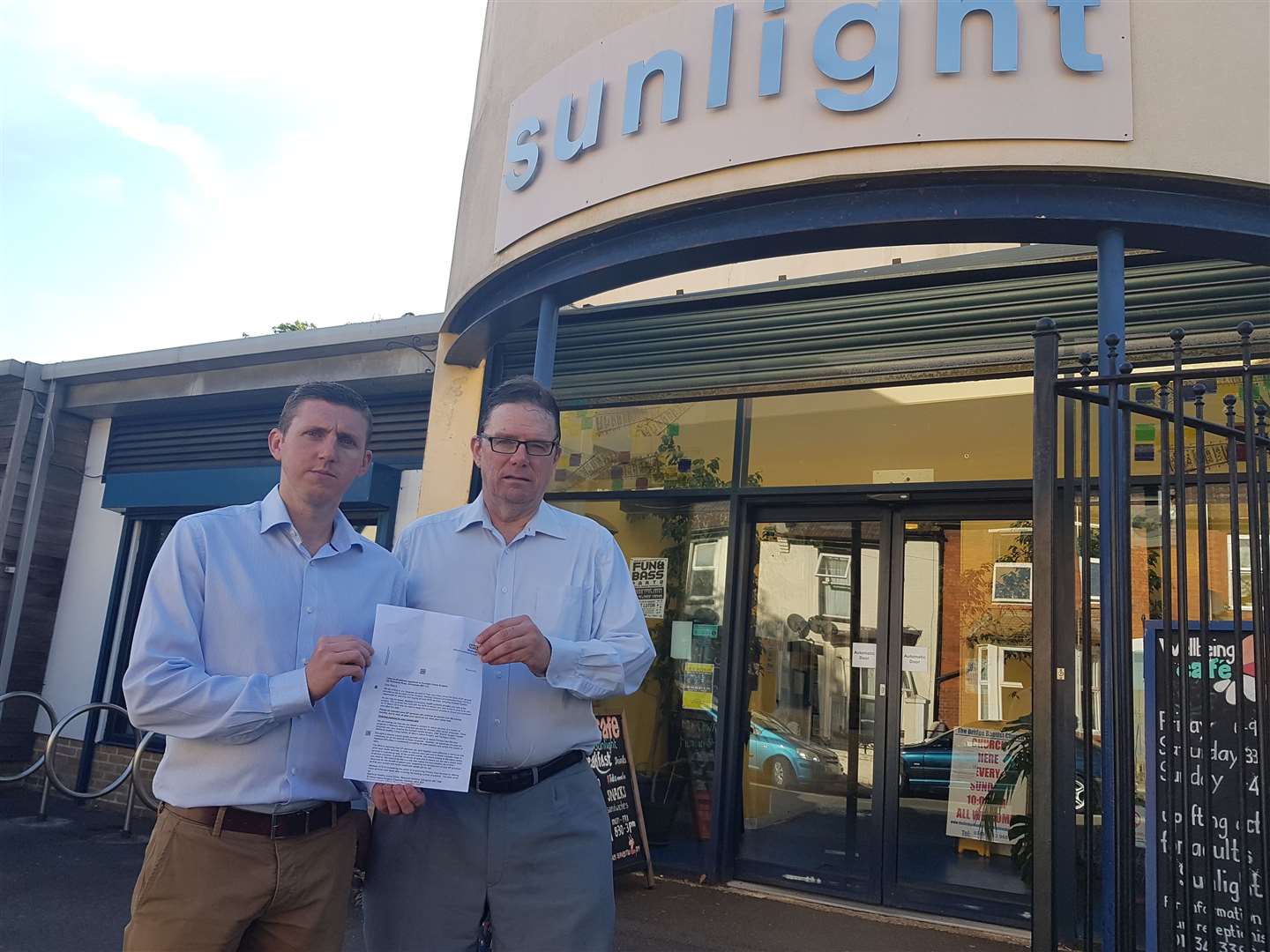 Councillors Andy Stamp (left) and Adam Price outside the Sunlight centre