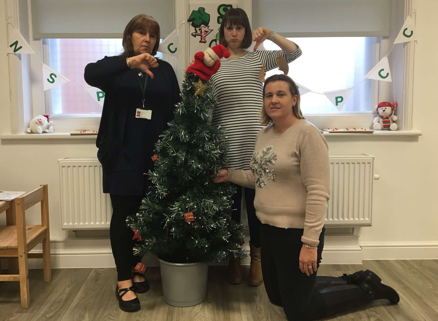 Staff at the NSPCC in Gillingham with their sorry-looking Christmas