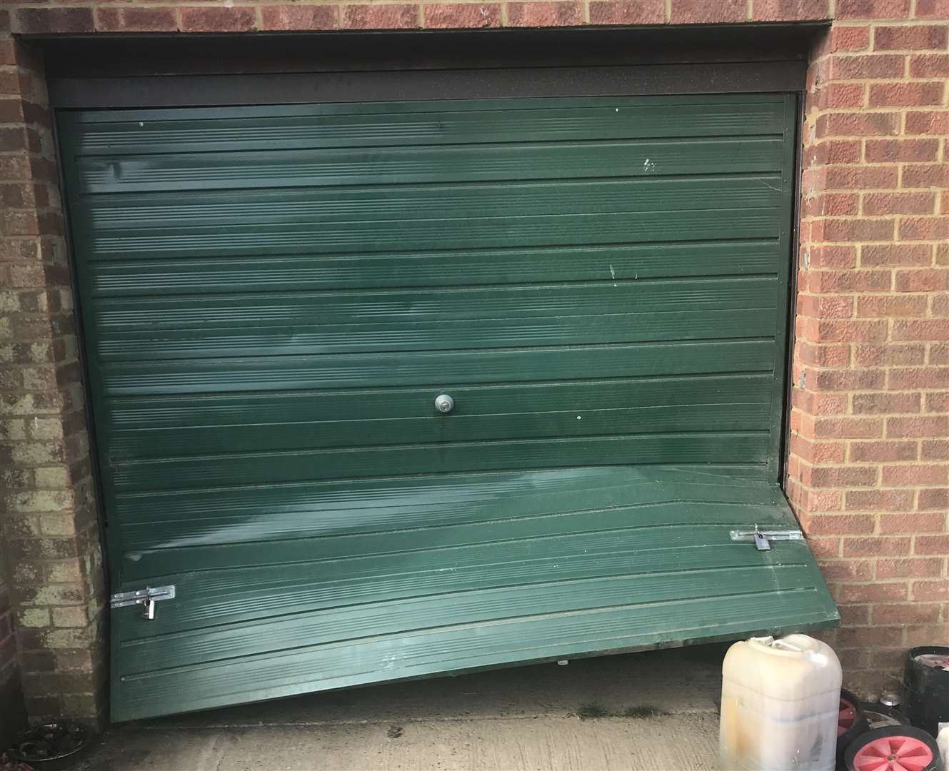 A garage door has been prised open